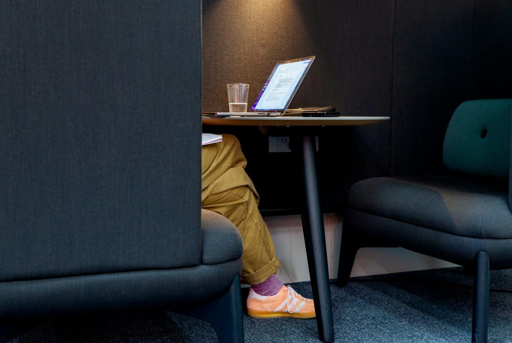 Person working at a desk in a modern office.